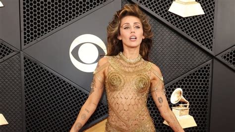 miley cyrus gold pins dress.